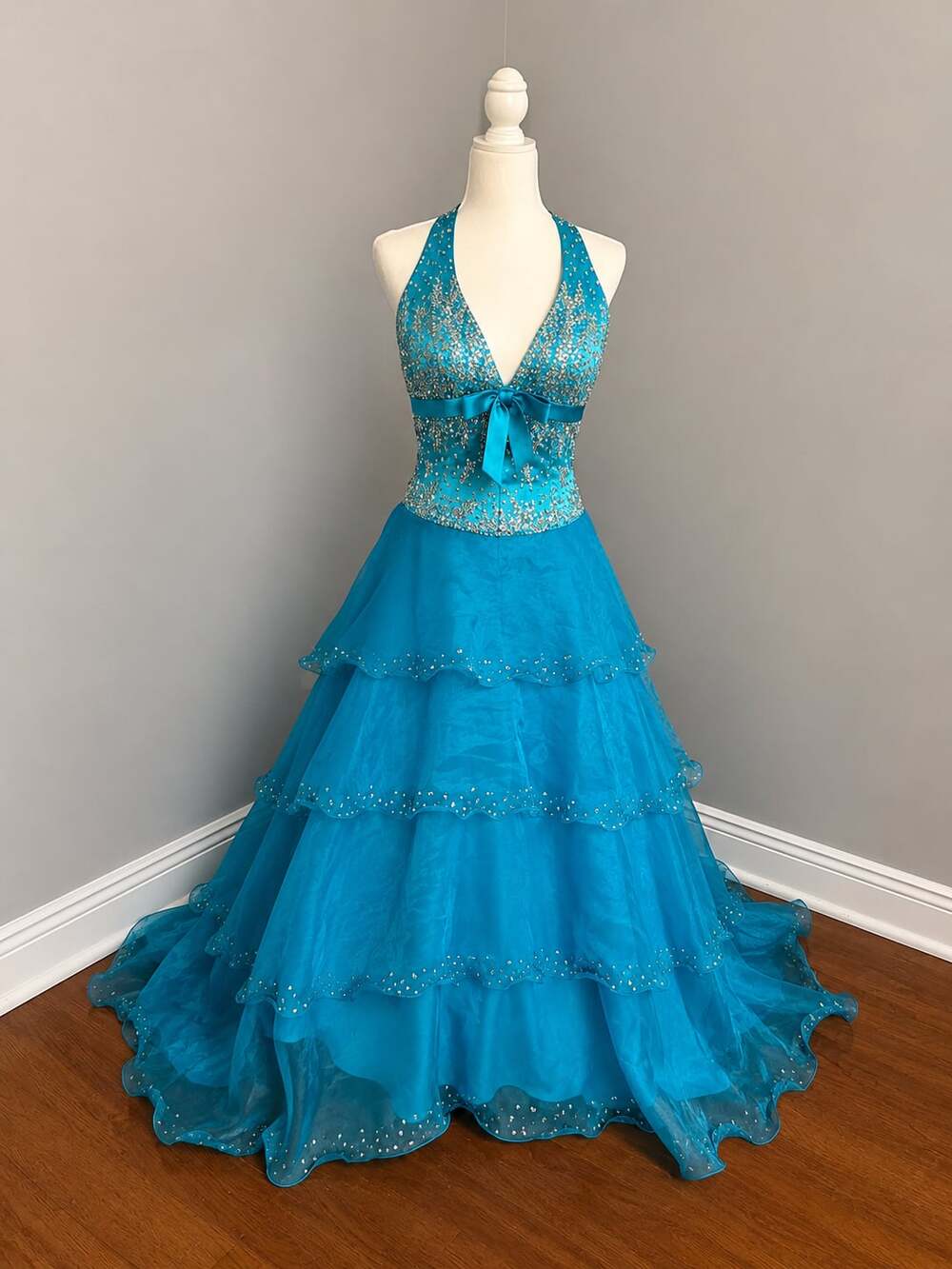Long teal halter-style beaded dress